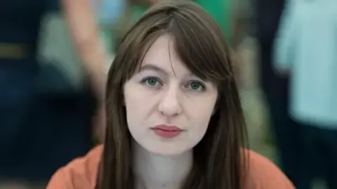The acclaimed novelist declares she is unable to visit the UK due to legal concerns